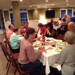 Group of people sitting at a table.