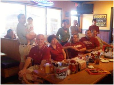 Group of people sitting in front of window.