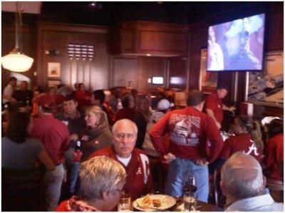 Group of people sitting at tables.