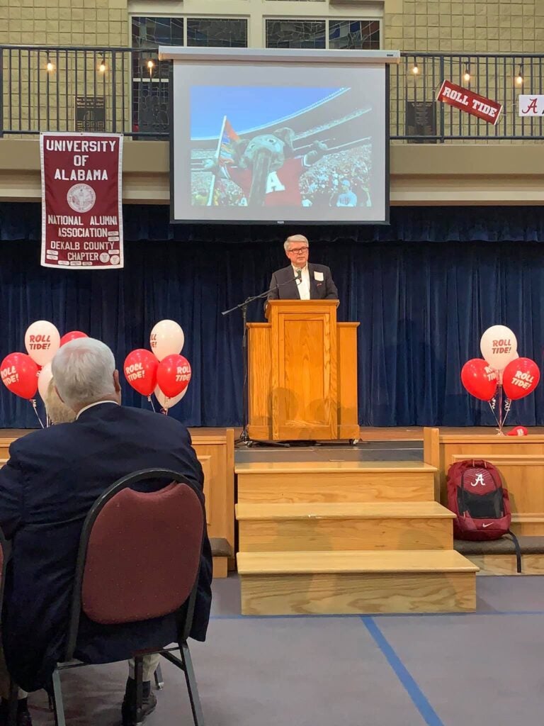 Man standing behind podium