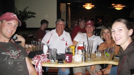 Two men sitting at table.
