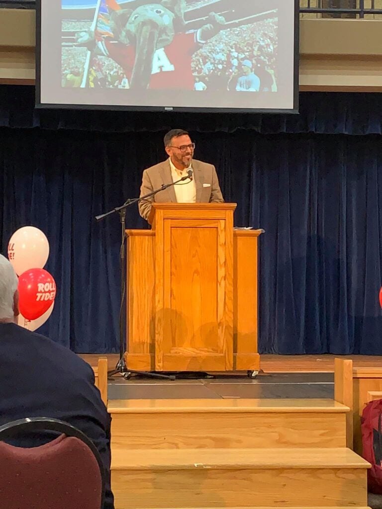 Man standing behind podium