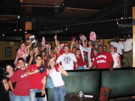 Group of people standing outside at night