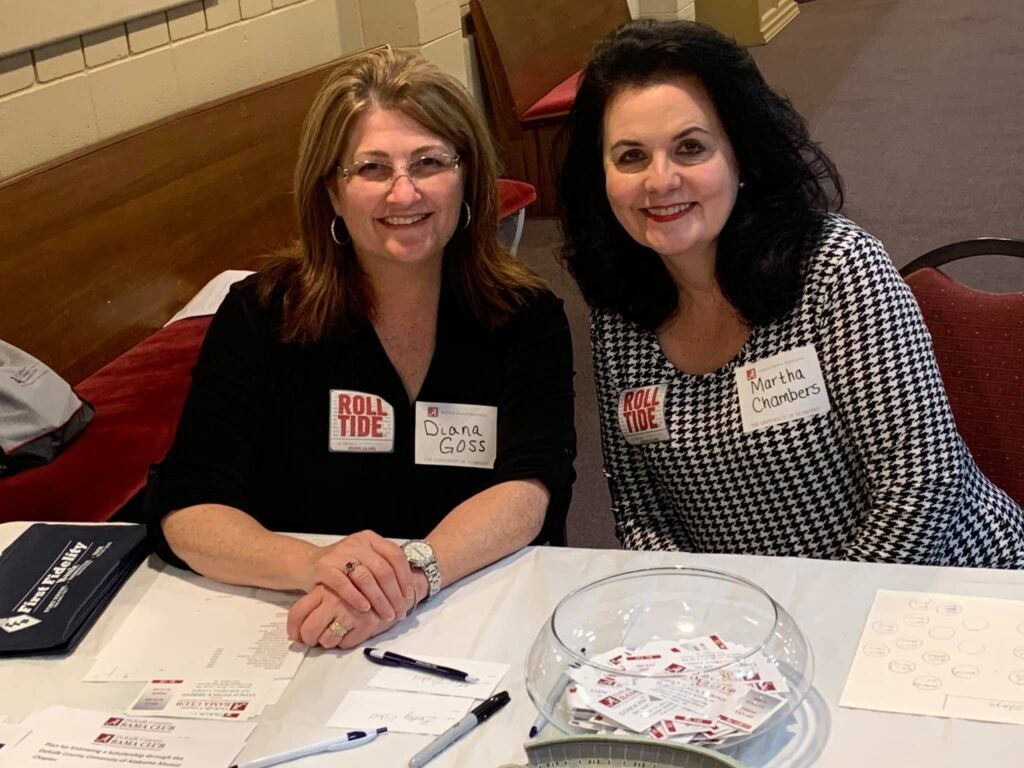 Two ladies sitting at table
