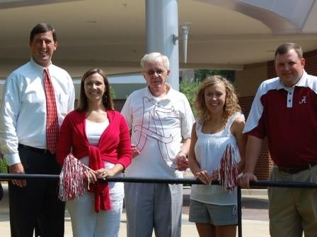 Group of people standing outside.