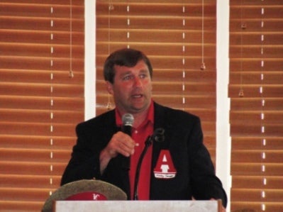 Man in Black Jacket with microphone.