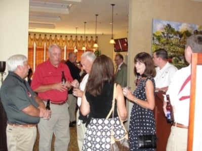 Group of people standing in room.