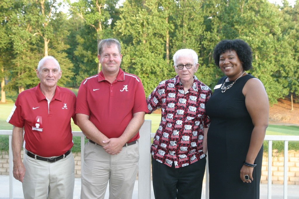 Group of people standing outside.