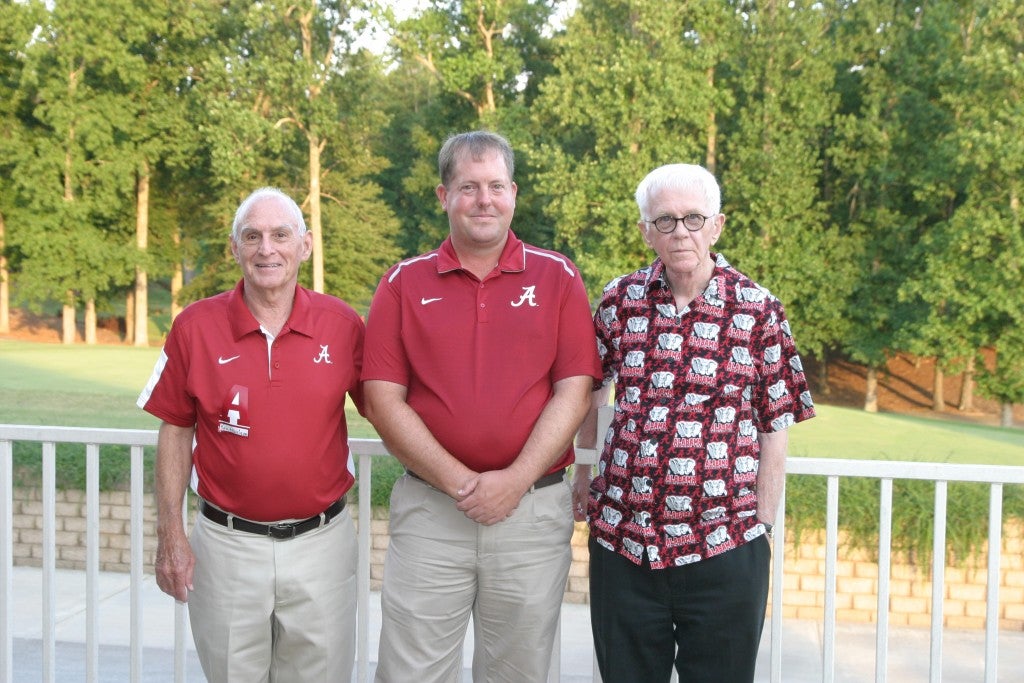 Group of people standing outside.