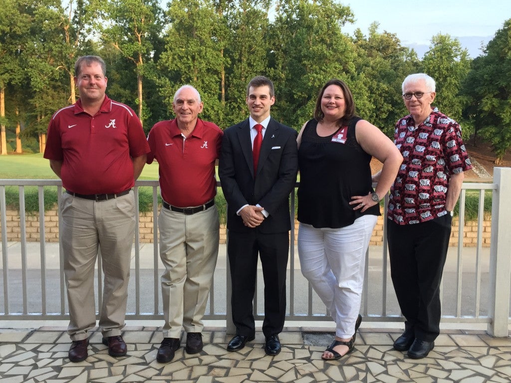 Group of people standing outside.