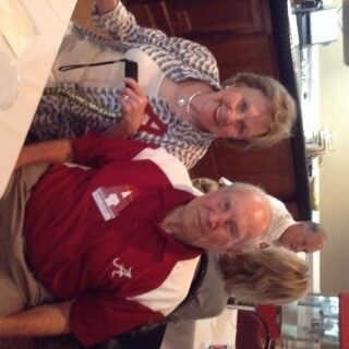 Man and women sitting at a table.