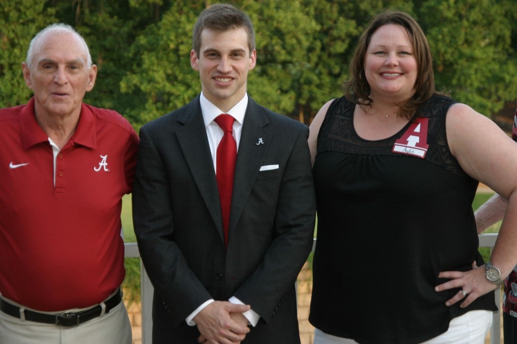 Group of people standing outside.