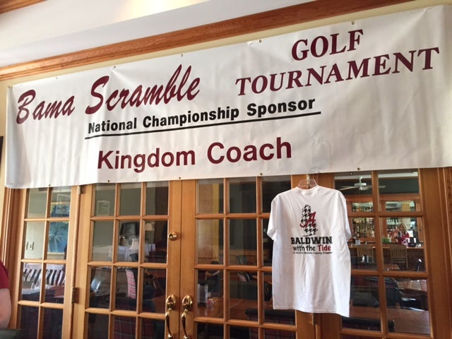 White banner hanging over brown glass door.