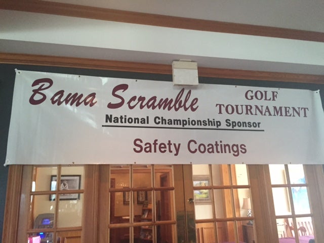 Top of white glass door with banner on top.