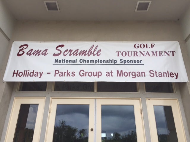 Top of white glass door with banner on top.