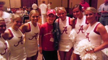 Group of people dressed in red and white standing in room with dim light.