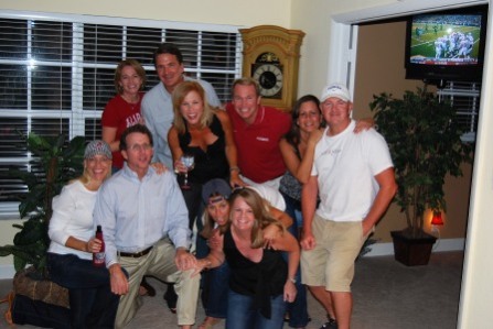 Group of people standing in front of window.