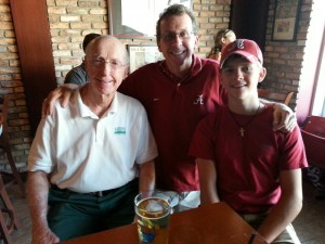 a group of three guys in a brick restaurant