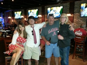 a group of four people in a brick restaurant