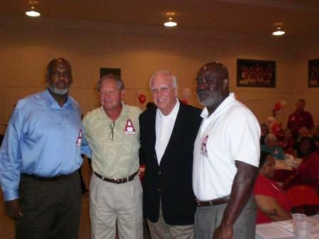 Group of people standing in room.