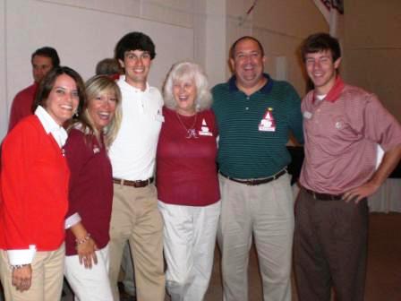 Group of people standing in room.