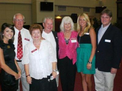Group of people standing in room.