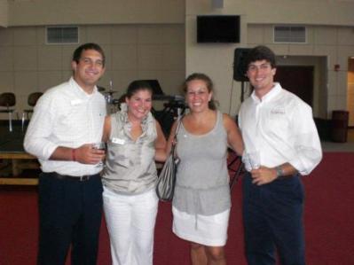 Group of people standing in room.