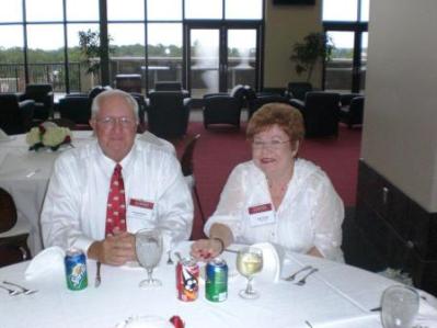 Two people sitting at table.