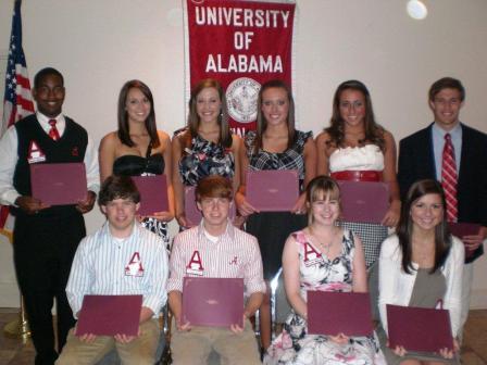 Group of students holding award certificates.