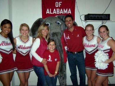 Group of people standing in room with Big AL.