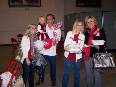 Group of people standing in room.
