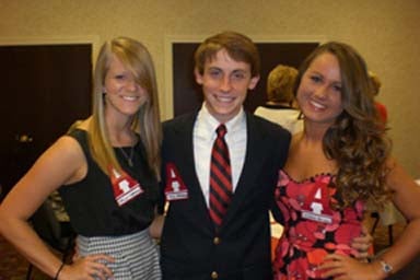 Group of people standing in room.