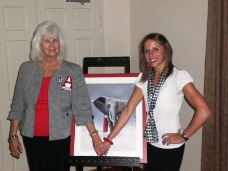 Two people standing in front of Elephant Picture.