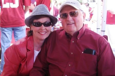 Two people in red shirts and