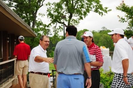 Group of people standing outside.