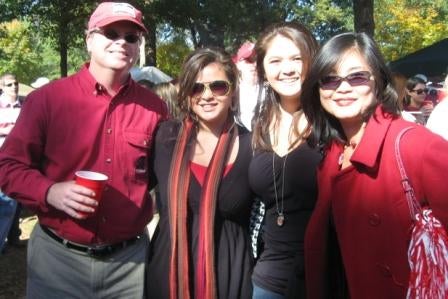 Group of people standing outside.
