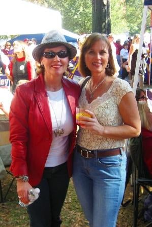 Two ladies standing outside.