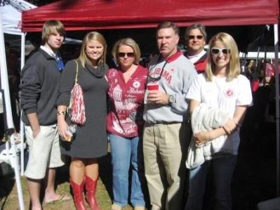 Group of people standing outside.