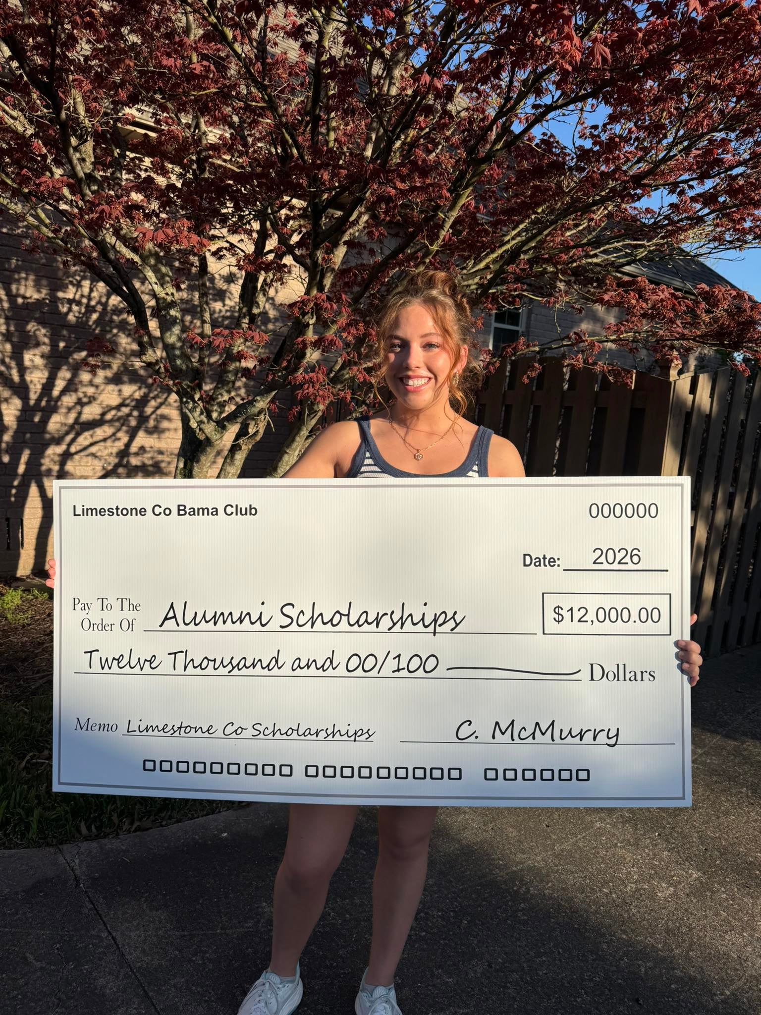 The Limestone County Bama Club presented a $12,000.00 check to the UA National Alumni Association for our local scholarships! Langley Redmill, one of our past recipients, is pictured.