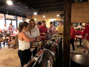 Group of people in buffet line.