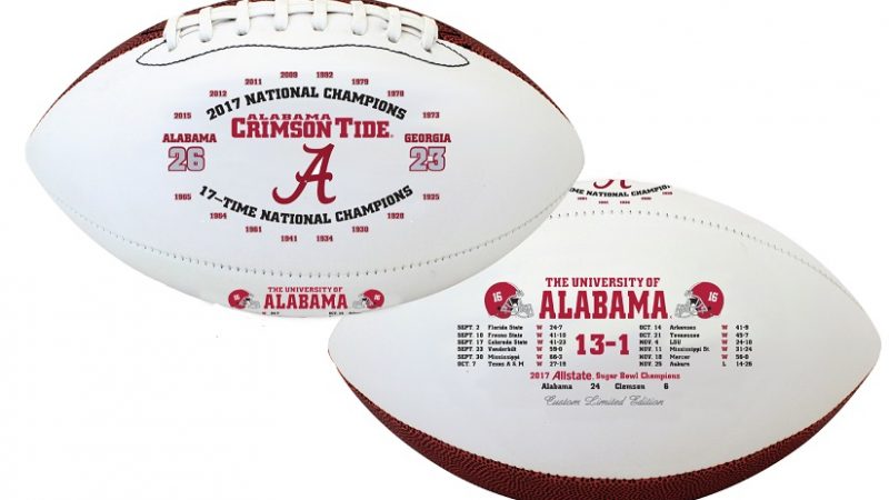 Two footballs with 2017 season's information and UA logos on them