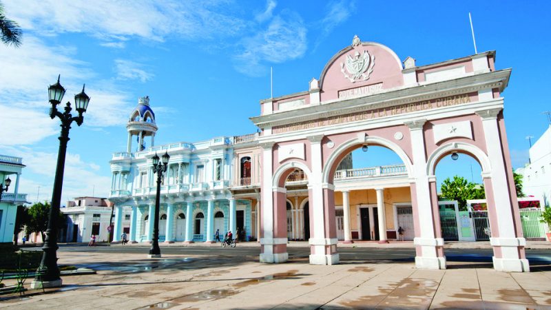 A public square in Cuba with pastel buildings