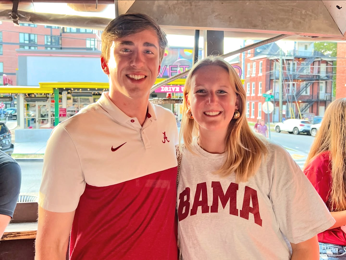 Male and female UA gradswearing UA shirts