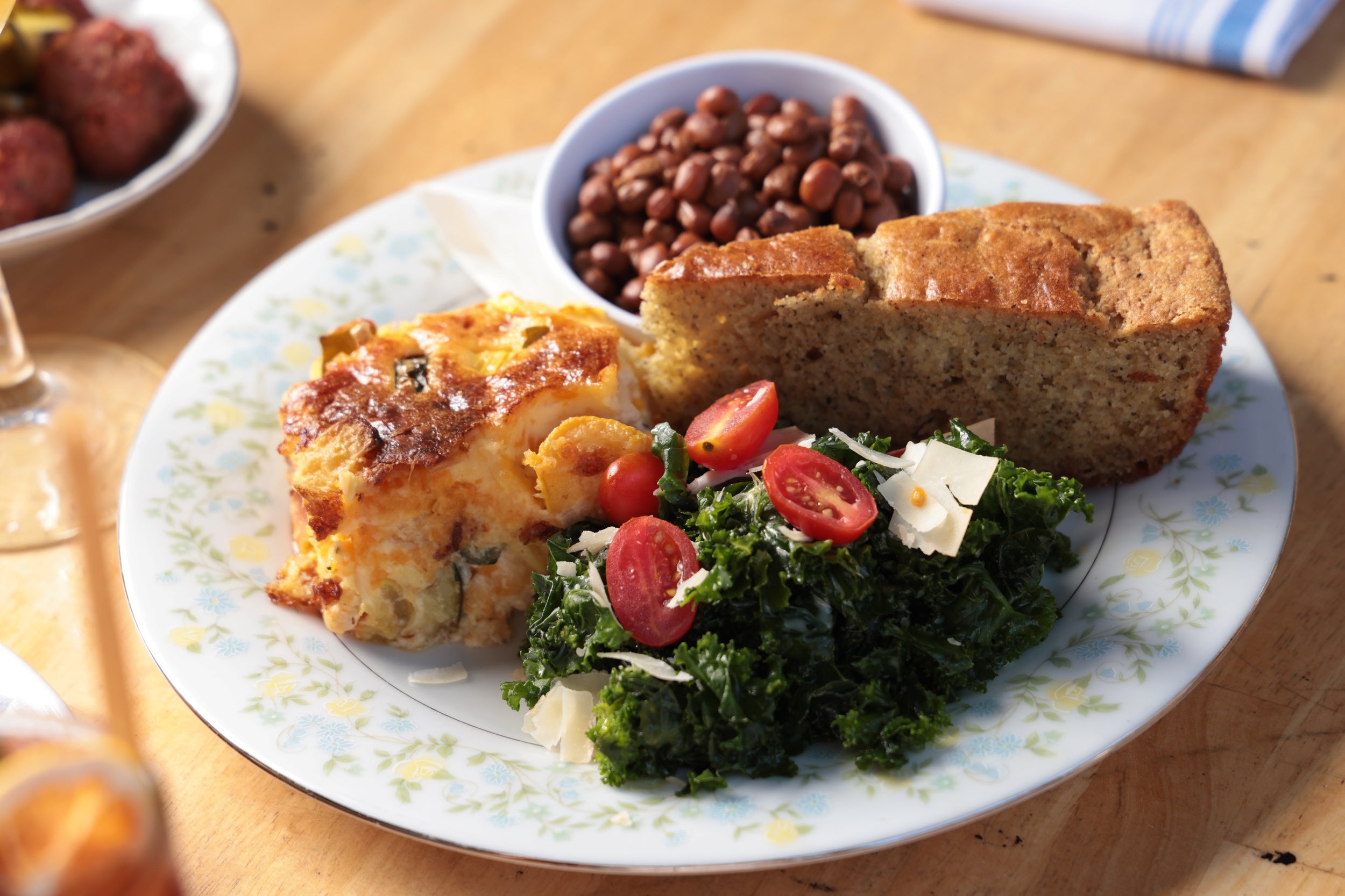 Macaroni and cheese, beans, collards and cornbread by The Noble South
